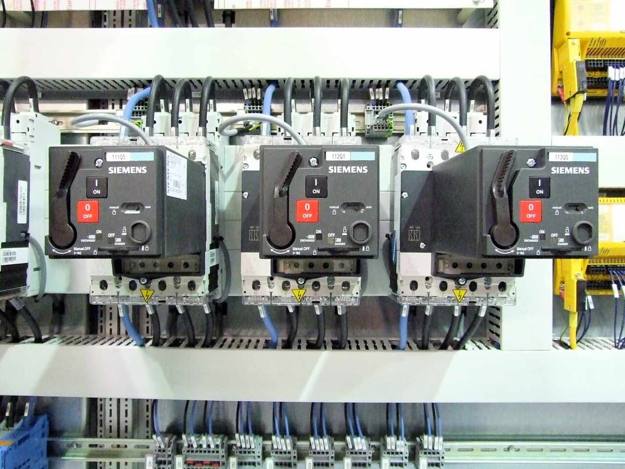 Electrical control panel with circuit breakers and wired terminations